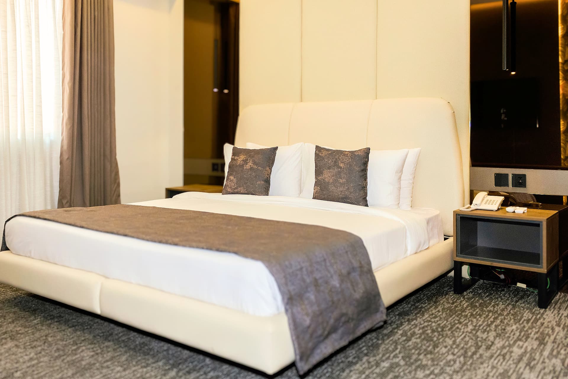Modern suite at LEORK Hotels Rawalpindi with contemporary furnishings, ideal for airport layovers and pre-flight stays