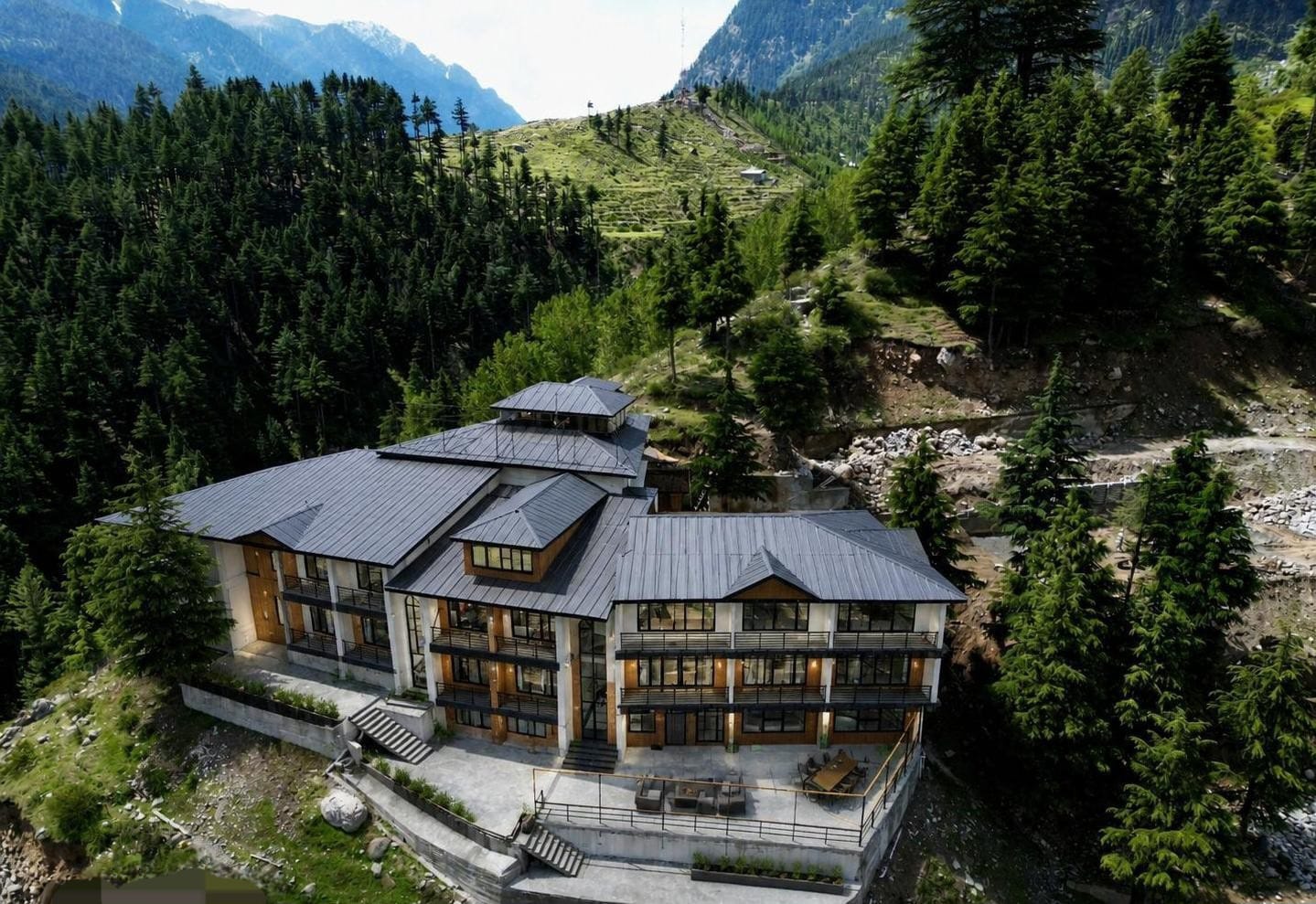Aerial view of LEORK Hotel Kalam surrounded by pine forests