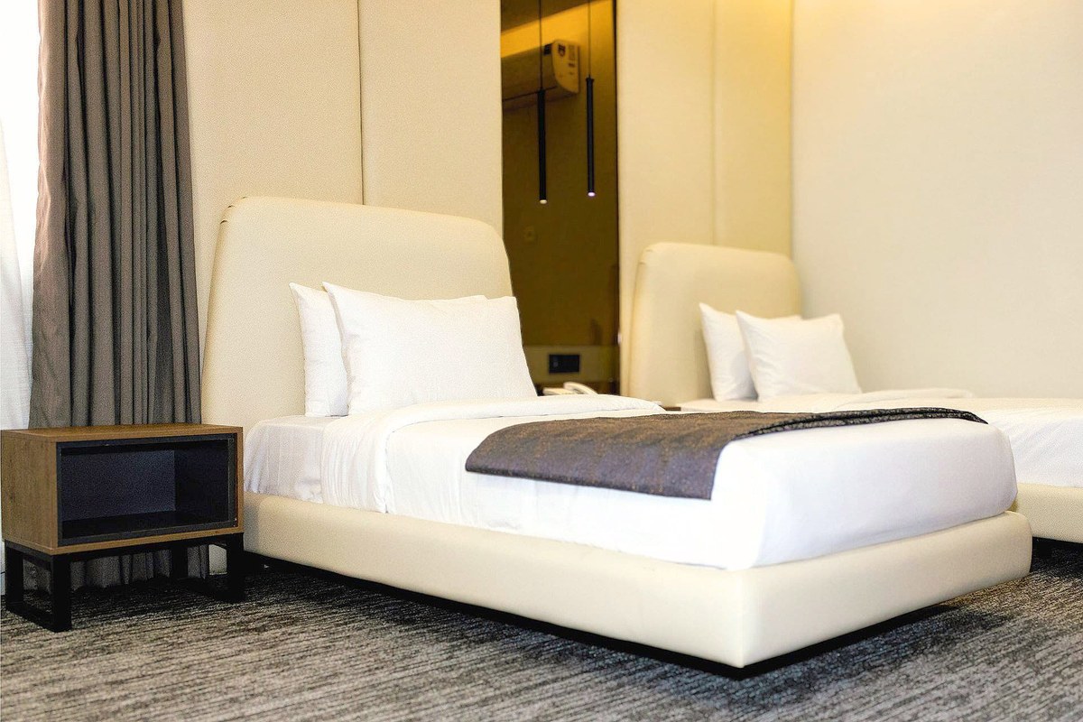 Twin room at LEORK Hotels Rawalpindi with two separate single beds