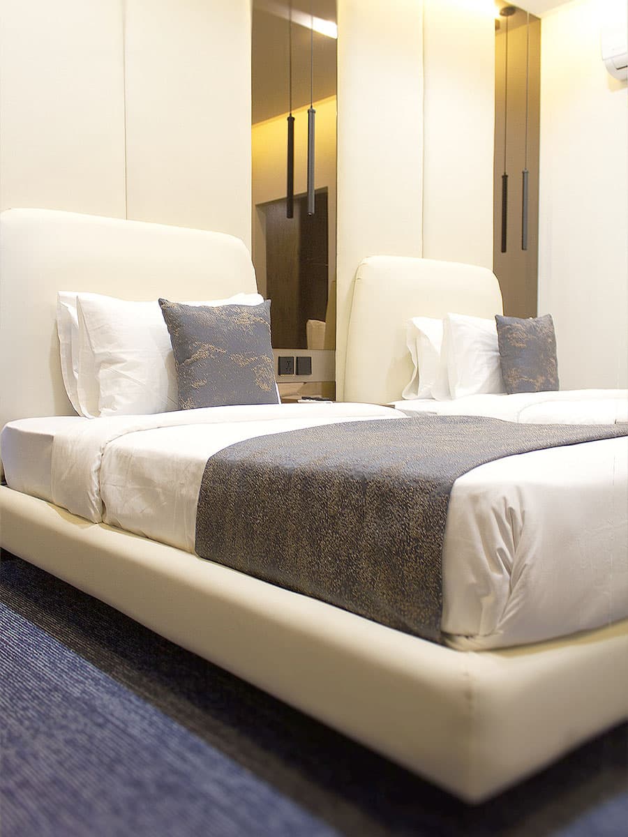 Twin Room at LEORK Hotels Rawalpindi with two single beds, ideal for wedding guests sharing